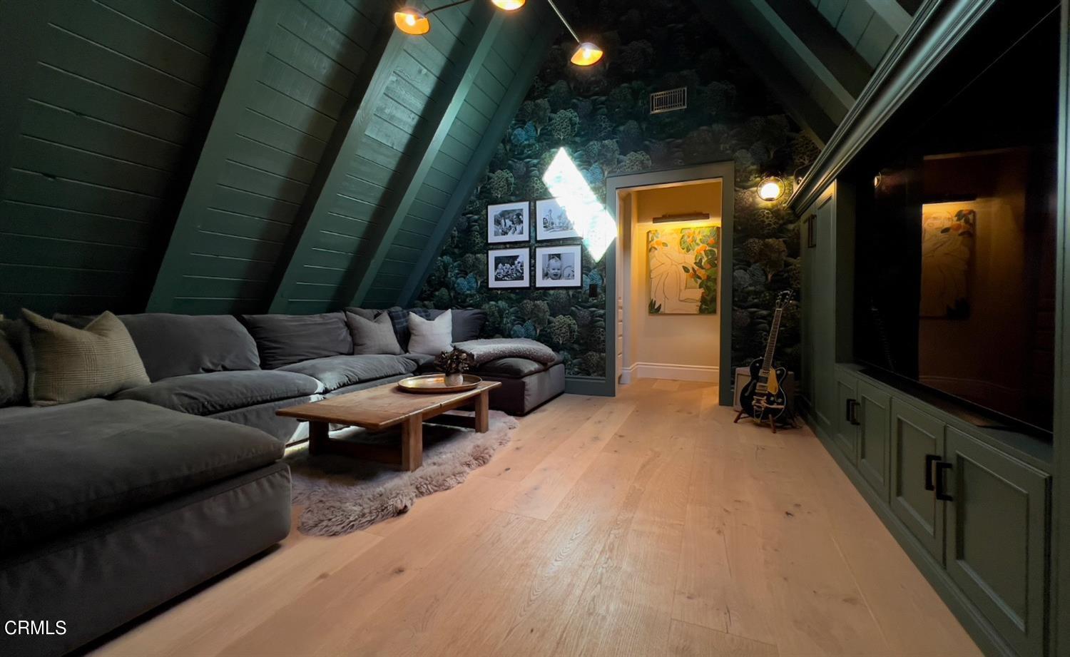 2460 Valley Meadow Drive Oak View, CA 93022 - Photo 20 of 49 a living room with furniture a flat screen tv and a fireplace