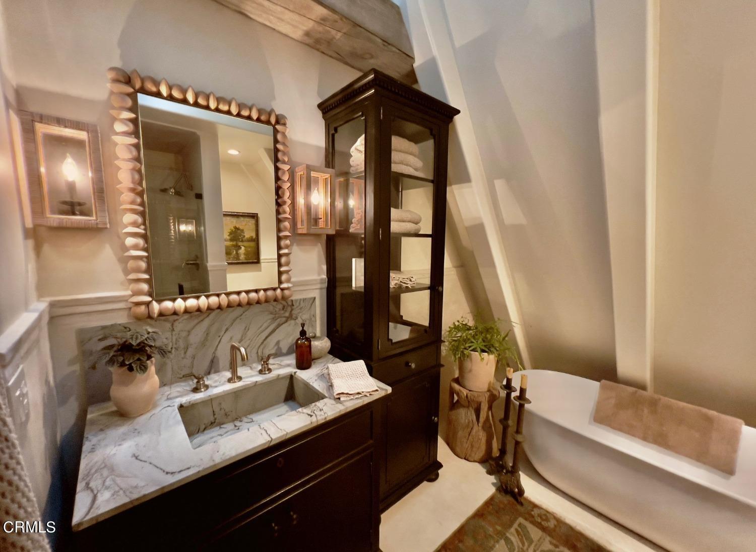 2460 Valley Meadow Drive Oak View, CA 93022 - Photo 31 of 49 a bathroom with a granite countertop sink and a mirror