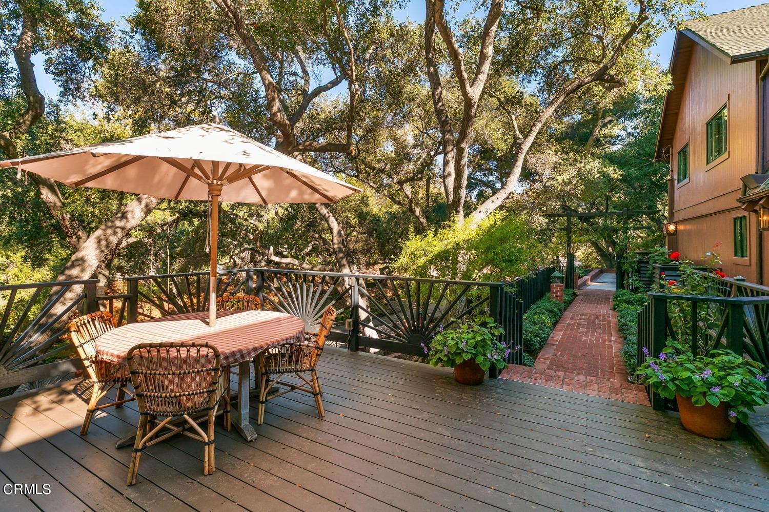 2460 Valley Meadow Drive Oak View, CA 93022 - Photo 40 of 49 a view of a patio with furniture and umbrella