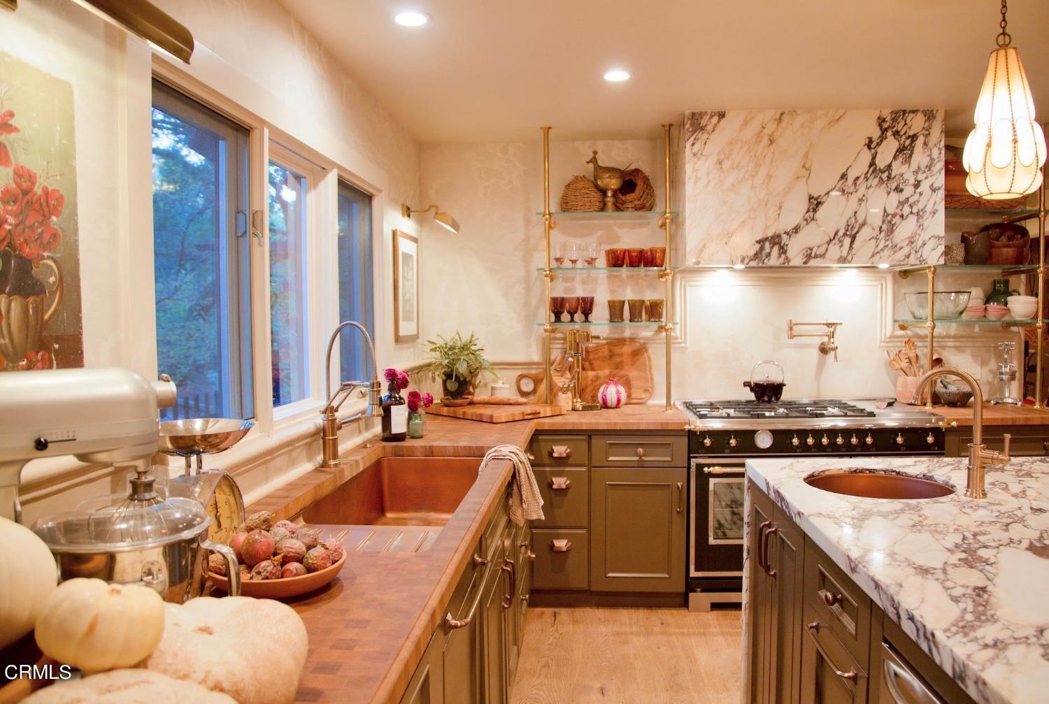2460 Valley Meadow Drive Oak View, CA 93022 - Photo 4 of 49 a kitchen with a stove a sink and a refrigerator