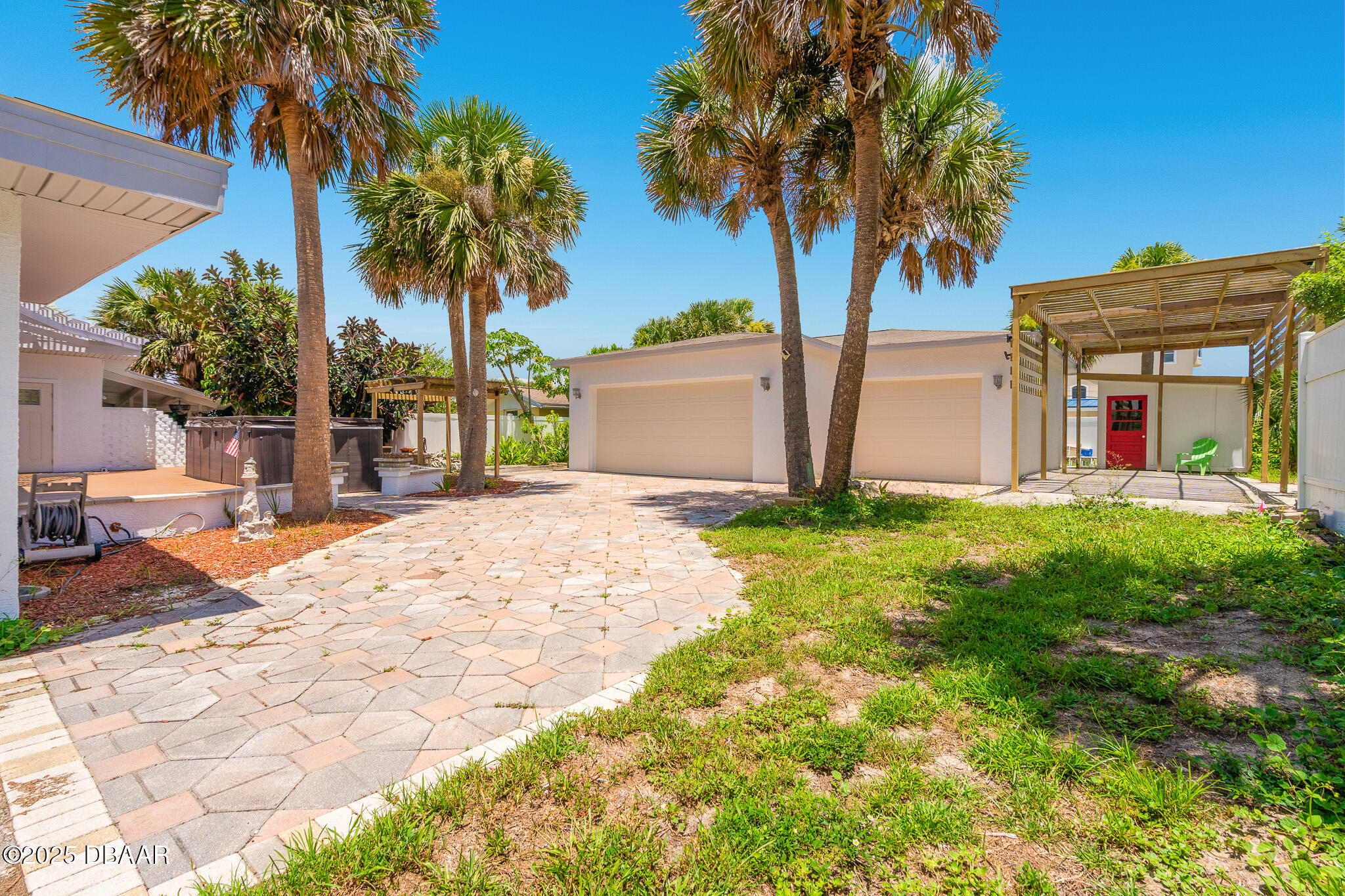 46 Oceanview Avenue Ponce Inlet, FL 32127 - Photo 51 of 79 a front view of a house with garden and tree