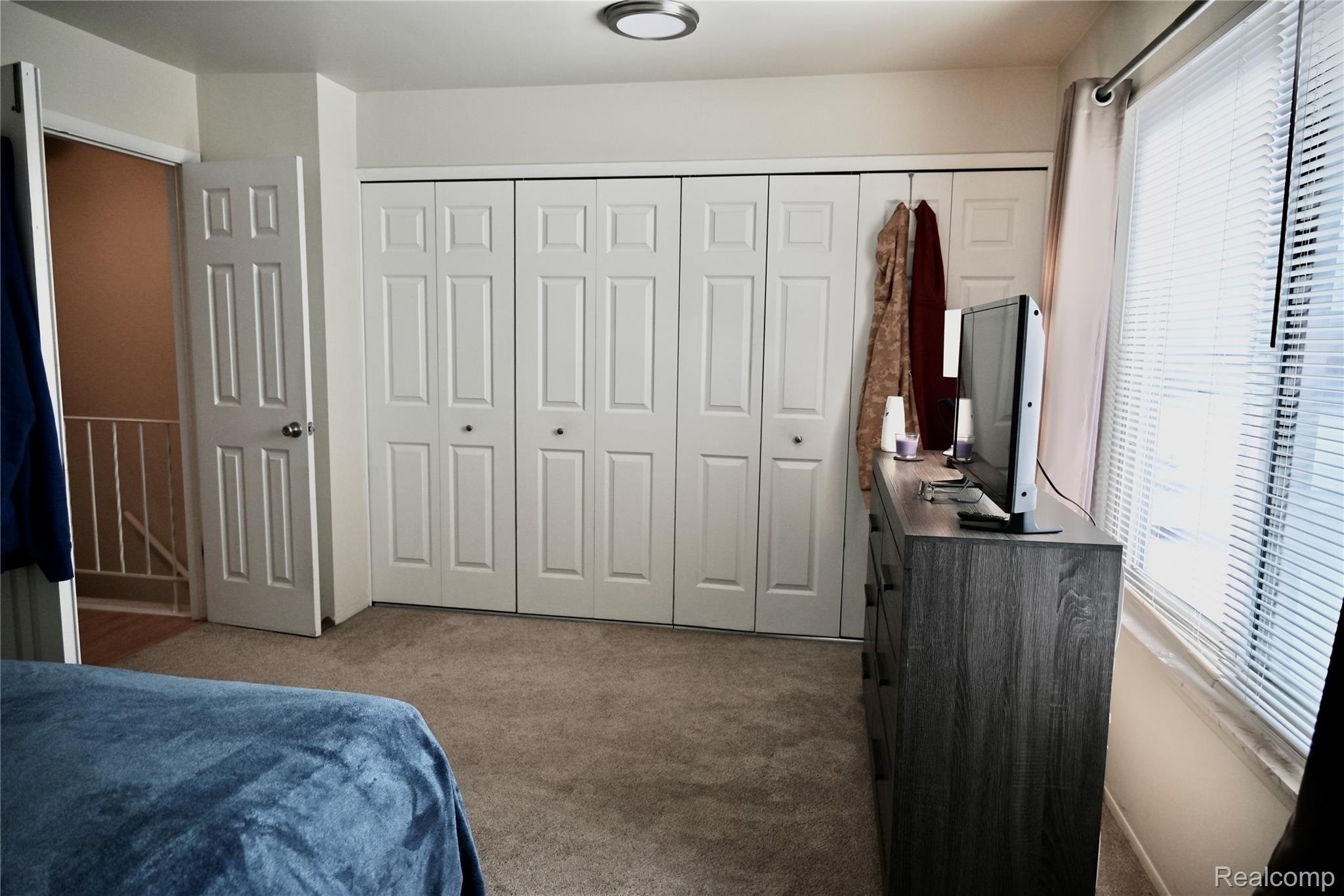 16285 Raleigh Square Drive Southgate, MI 48195 - Photo 21 of 25 Bedroom with carpet flooring, a closet, and an office area