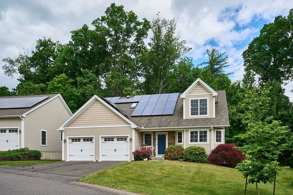 20 Bridge Road, Unit 18 Northampton, MA 01062 - Photo 1 of 42 a view of house and garden with large trees