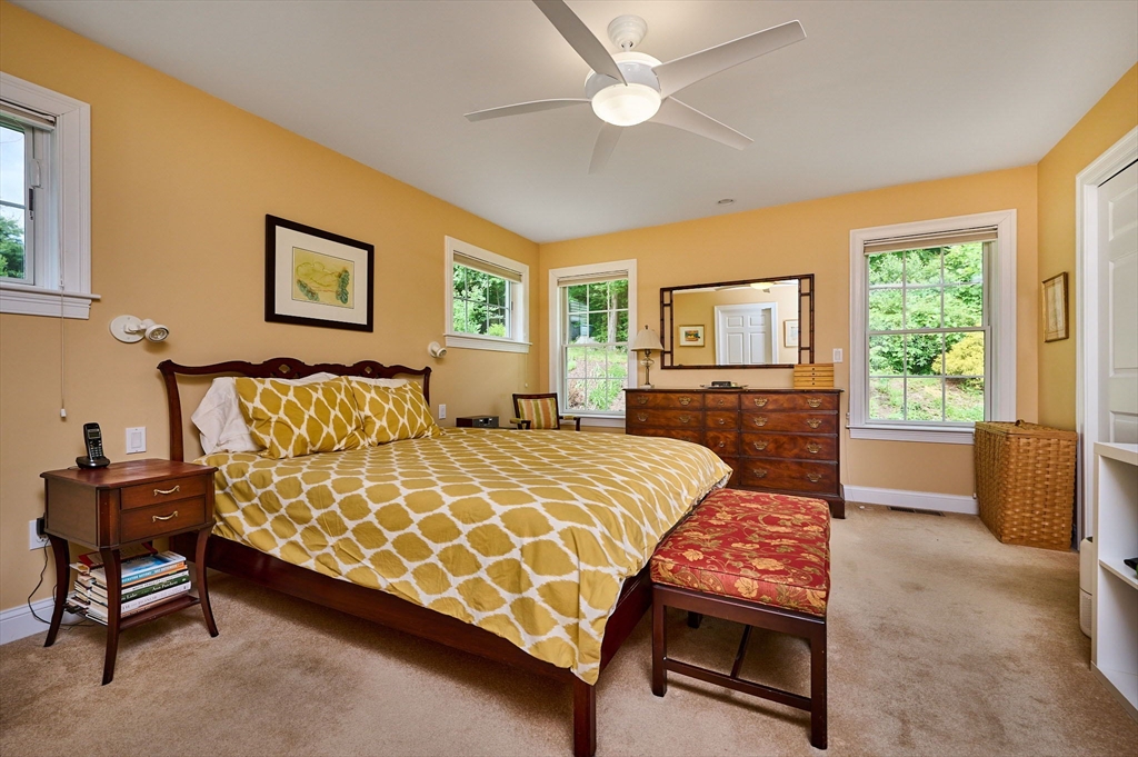 20 Bridge Road, Unit 18 Northampton, MA 01062 - Photo 14 of 42 a bedroom with a bed a couch and a window