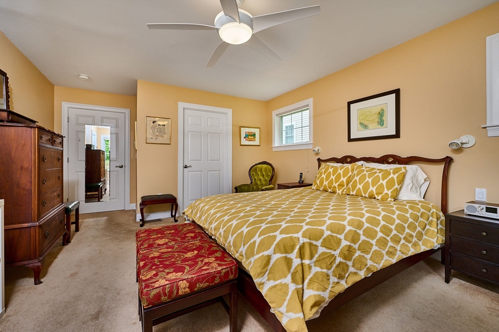 20 Bridge Road, Unit 18 Northampton, MA 01062 - Photo 15 of 42 a bedroom with bed and a chandelier