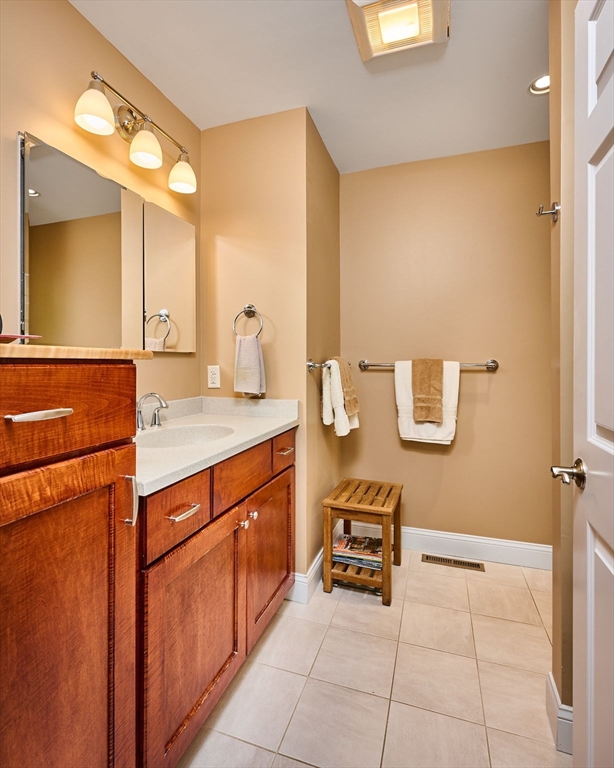 20 Bridge Road, Unit 18 Northampton, MA 01062 - Photo 16 of 42 a spacious bathroom with a sink and a mirror