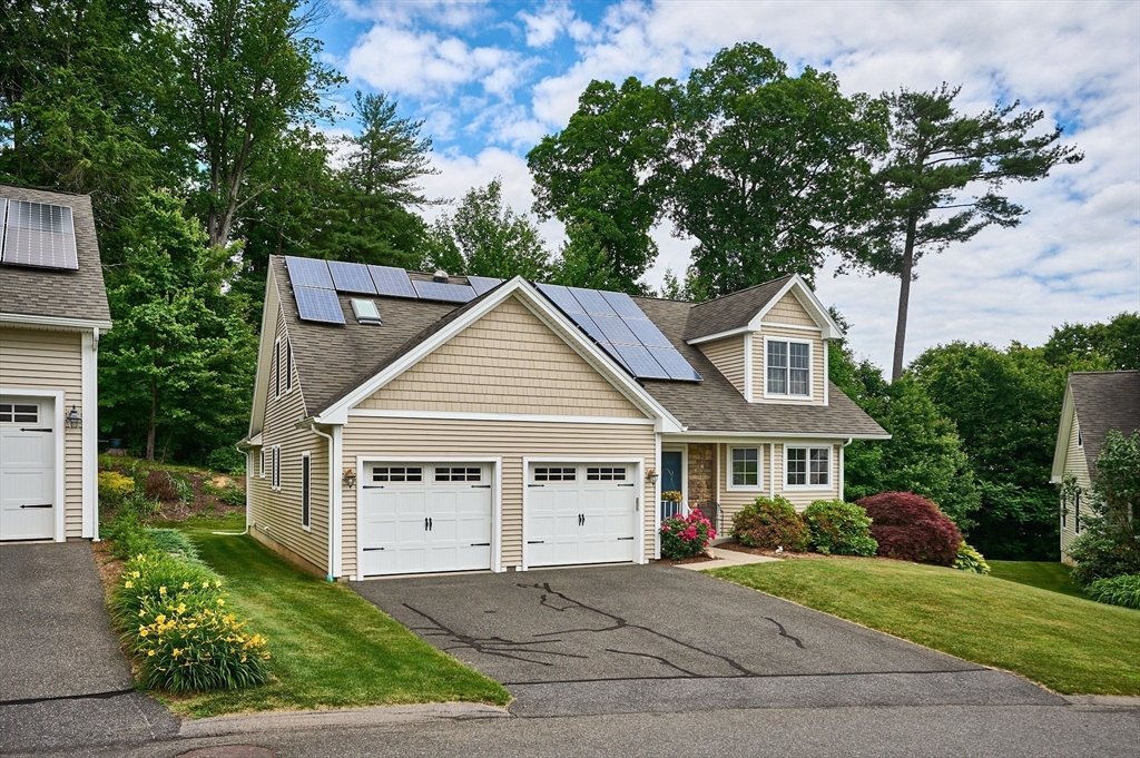 20 Bridge Road, Unit 18 Northampton, MA 01062 - Photo 2 of 42 front view of a house with a garden