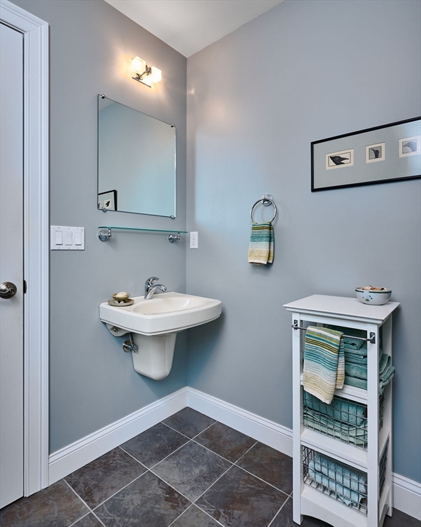 20 Bridge Road, Unit 18 Northampton, MA 01062 - Photo 21 of 42 a bathroom with a sink a toilet and mirror