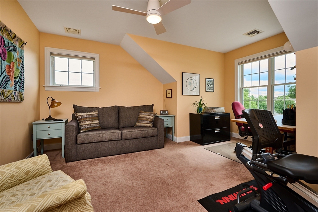 20 Bridge Road, Unit 18 Northampton, MA 01062 - Photo 23 of 42 a living room with furniture window and gym equipment