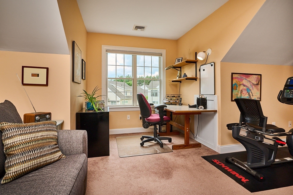 20 Bridge Road, Unit 18 Northampton, MA 01062 - Photo 24 of 42 a view of a workspace with furniture and a window