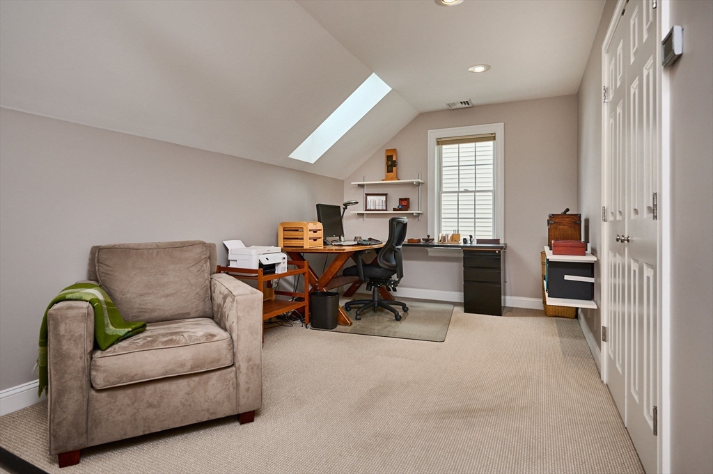 20 Bridge Road, Unit 18 Northampton, MA 01062 - Photo 27 of 42 a living room with furniture and a window