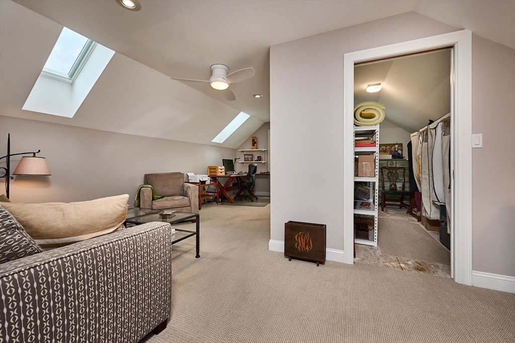 20 Bridge Road, Unit 18 Northampton, MA 01062 - Photo 29 of 42 a living room with furniture and a wooden floor