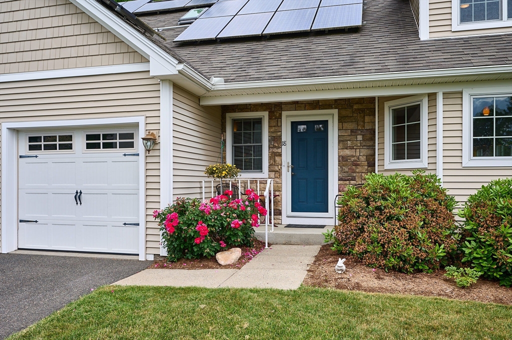 20 Bridge Road, Unit 18 Northampton, MA 01062 - Photo 3 of 42 a view of a house with a yard and a garden