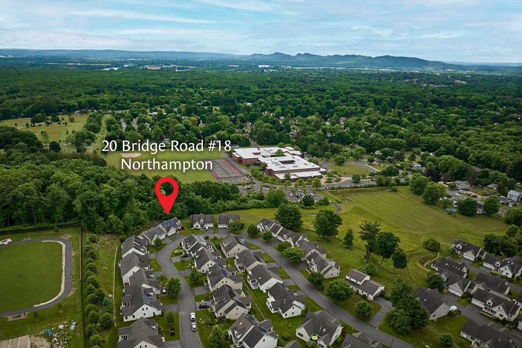 20 Bridge Road, Unit 18 Northampton, MA 01062 - Photo 37 of 42 a view of a lush green field with an ocean view