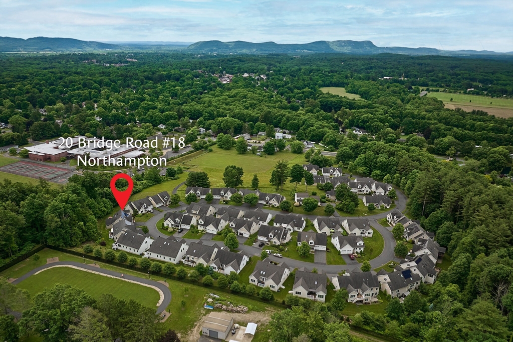 20 Bridge Road, Unit 18 Northampton, MA 01062 - Photo 39 of 42 an aerial view of residential houses with outdoor space and trees