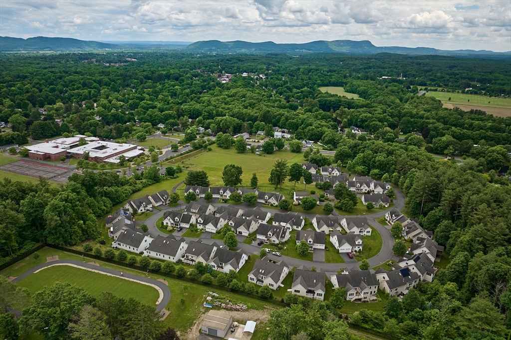 20 Bridge Road, Unit 18 Northampton, MA 01062 - Photo 40 of 42 an aerial view of residential houses with outdoor space and trees all around