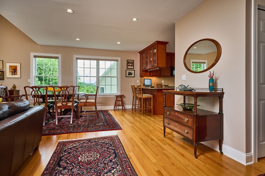 20 Bridge Road, Unit 18 Northampton, MA 01062 - Photo 7 of 42 a living room with fireplace furniture and a large window