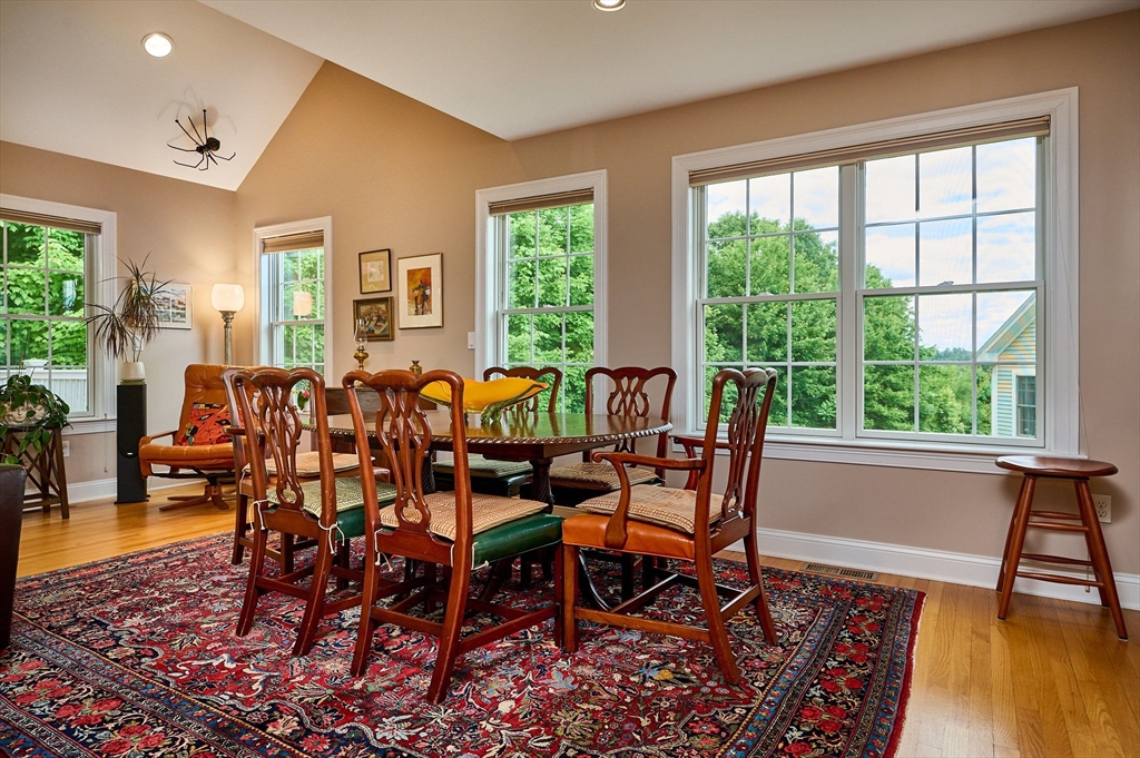 20 Bridge Road, Unit 18 Northampton, MA 01062 - Photo 8 of 42 a dining room with furniture and wooden floor