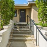 a view of stairs and yard