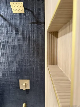 a view of an empty room with a kitchen