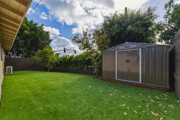 a backyard of a house with lots of green space