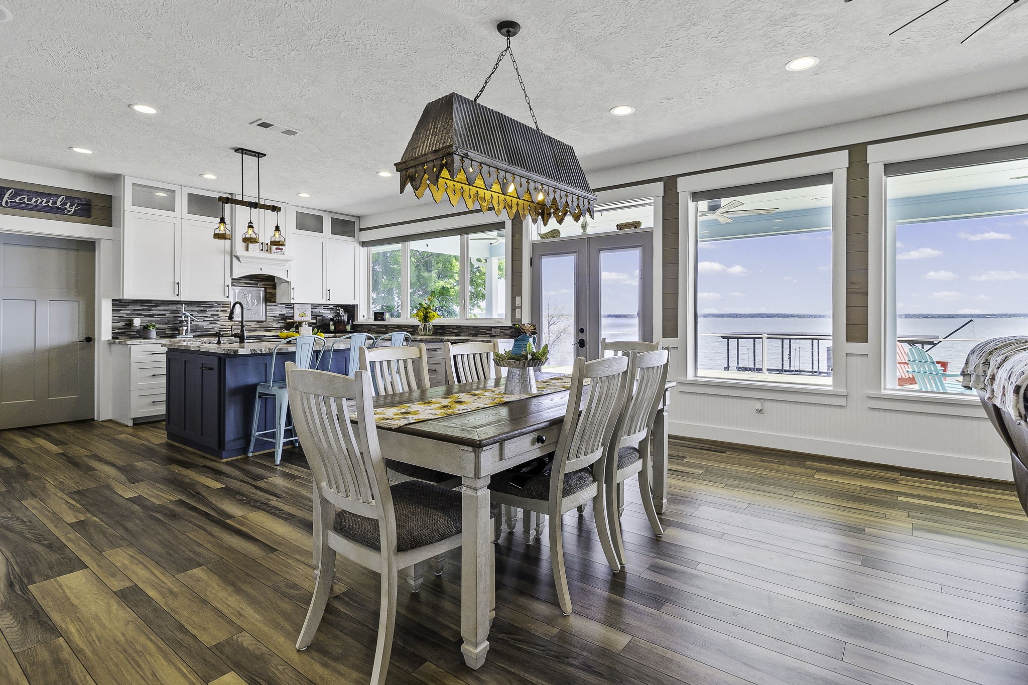 151 Key Largo Loop Point Blank, TX 77364 - Photo 9 of 49 Wall of windows fills the dining and kitchen area with natural light and stunning panoramic lake views.