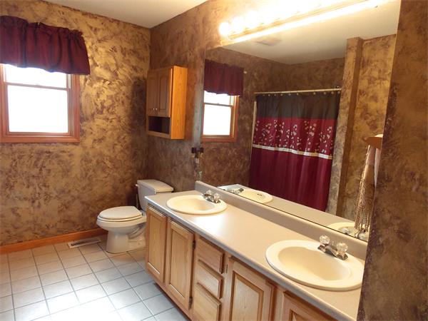 22 Dunbar Street Springfield, MA 01118 - Photo 13 of 21 a bathroom with a sink a toilet and mirror