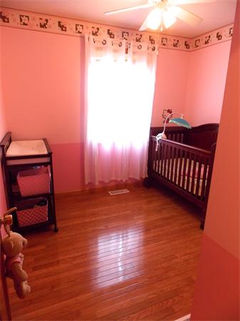 22 Dunbar Street Springfield, MA 01118 - Photo 14 of 21 a view of a room with wooden floor and chair