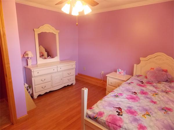 22 Dunbar Street Springfield, MA 01118 - Photo 15 of 21 a bedroom with a bed and a dresser