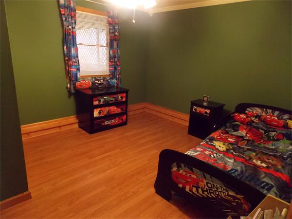 22 Dunbar Street Springfield, MA 01118 - Photo 16 of 21 a bedroom with a bed and window