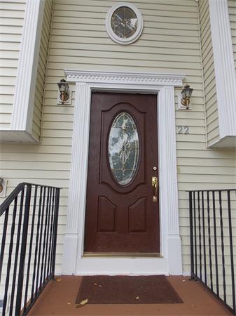 22 Dunbar Street Springfield, MA 01118 - Photo 2 of 21 a front view of a house with a garden