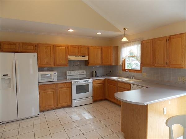 22 Dunbar Street Springfield, MA 01118 - Photo 3 of 21 a kitchen with stainless steel appliances granite countertop a sink and a stove