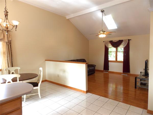 22 Dunbar Street Springfield, MA 01118 - Photo 6 of 21 a view of a livingroom with furniture and hardwood floor