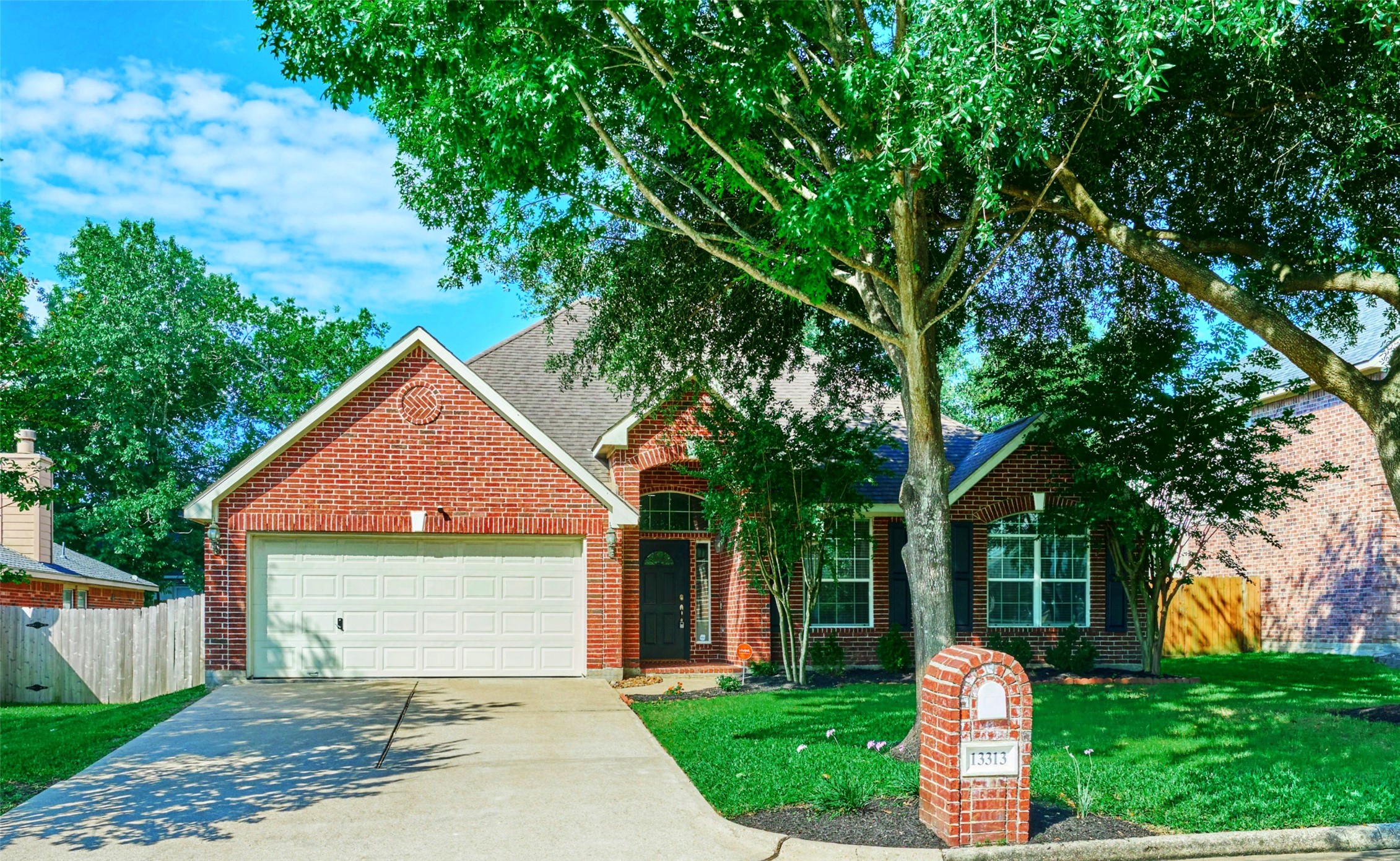 13313 Enchanted Way Montgomery, TX 77356 - Photo 36 of 36 a front view of a house with a yard and garage