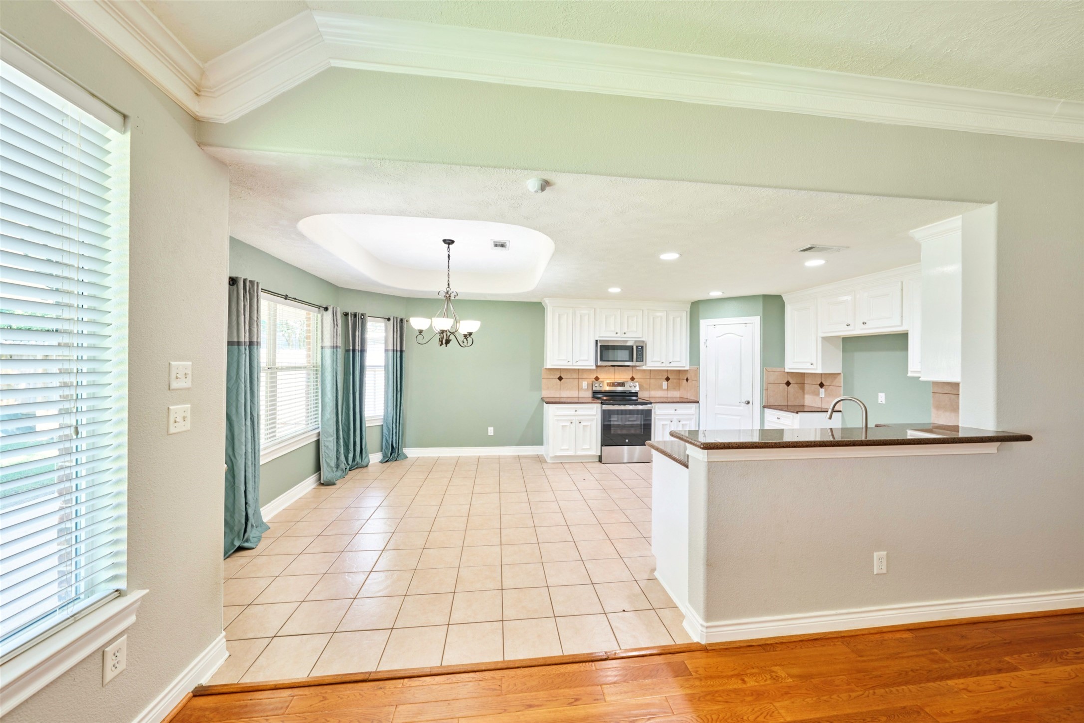 13313 Enchanted Way Montgomery, TX 77356 - Photo 10 of 36 a large white kitchen with kitchen view and a window