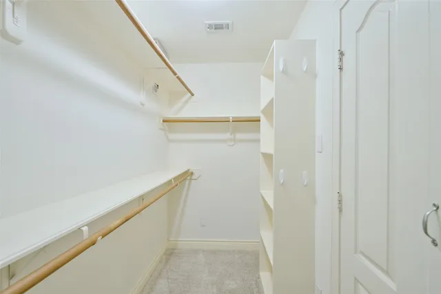 a spacious bathroom with a double vanity sink mirror and double