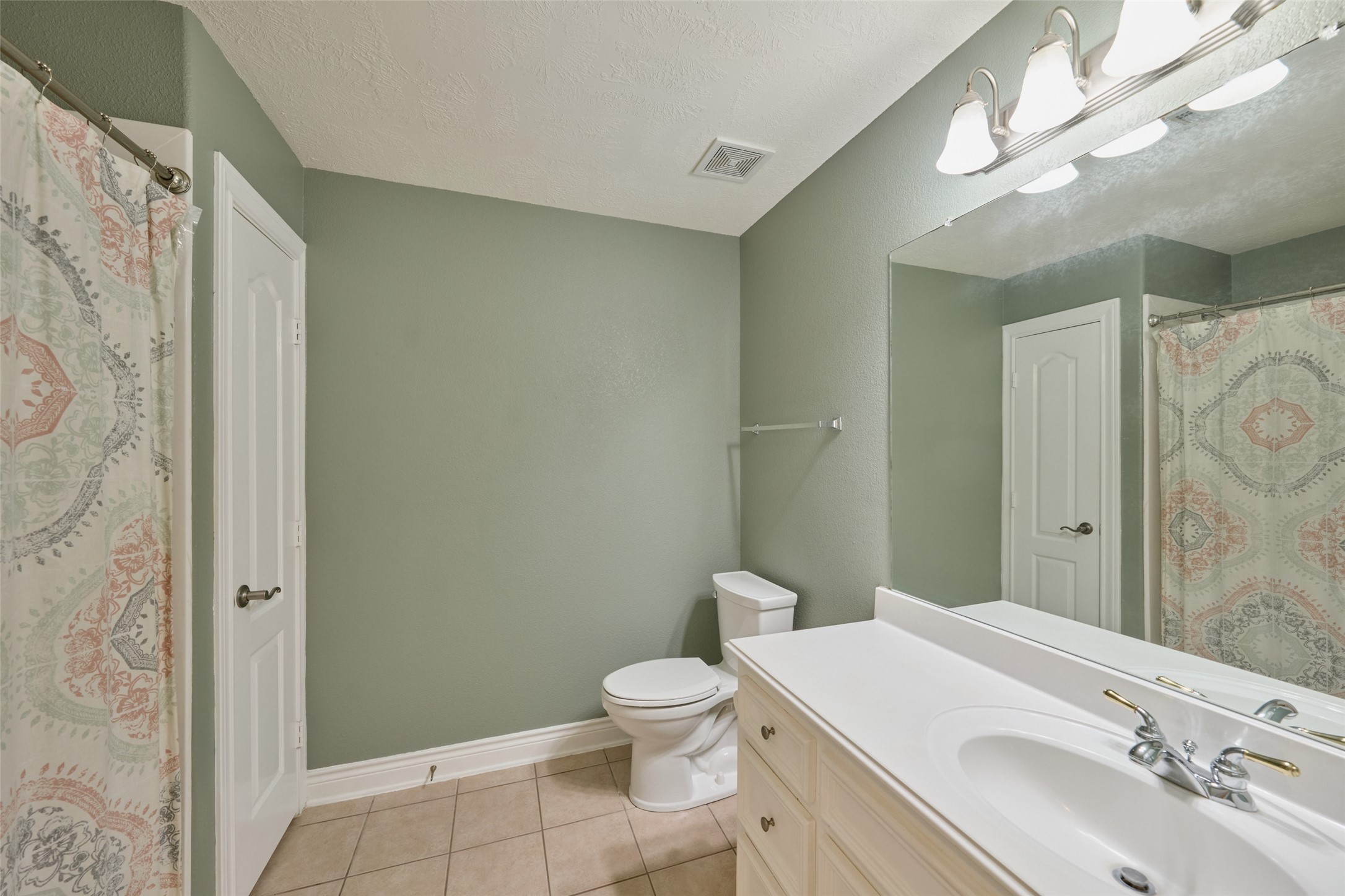 13313 Enchanted Way Montgomery, TX 77356 - Photo 27 of 36 a bathroom with a sink a toilet and shower