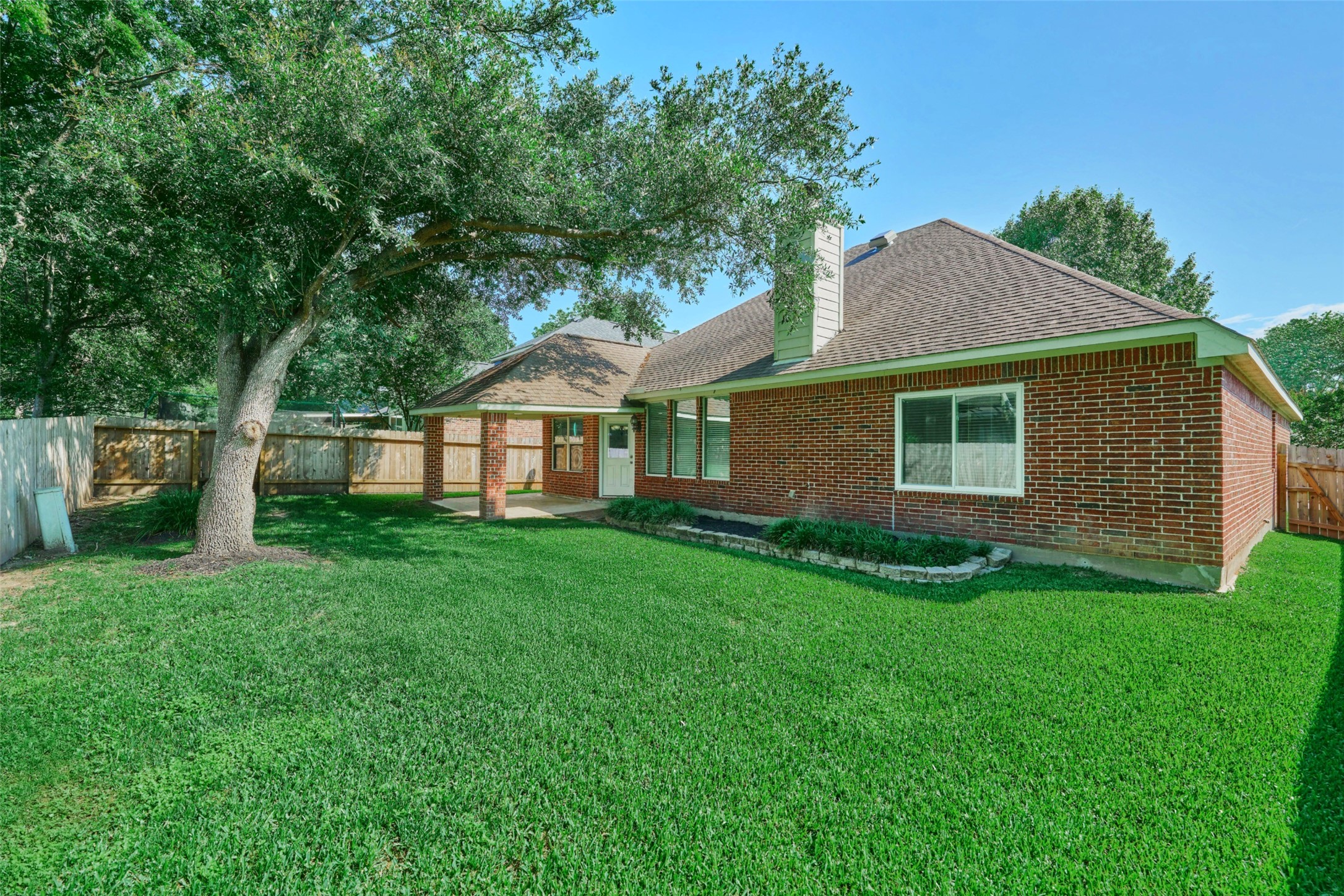 13313 Enchanted Way Montgomery, TX 77356 - Photo 29 of 36 a view of a yard in front of a house with plants and large tree