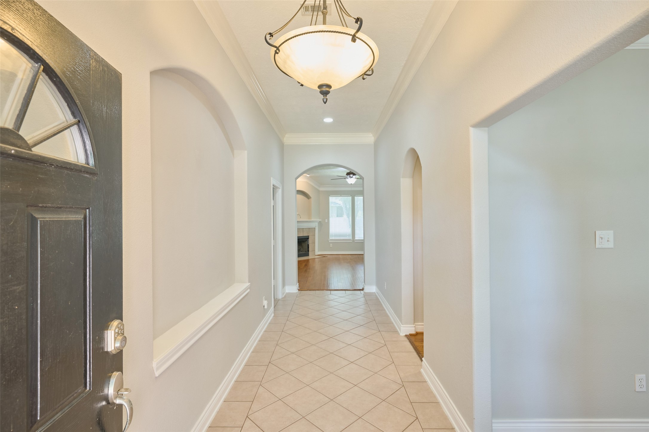 13313 Enchanted Way Montgomery, TX 77356 - Photo 2 of 36 a view of a hallway with a chandelier and entryway