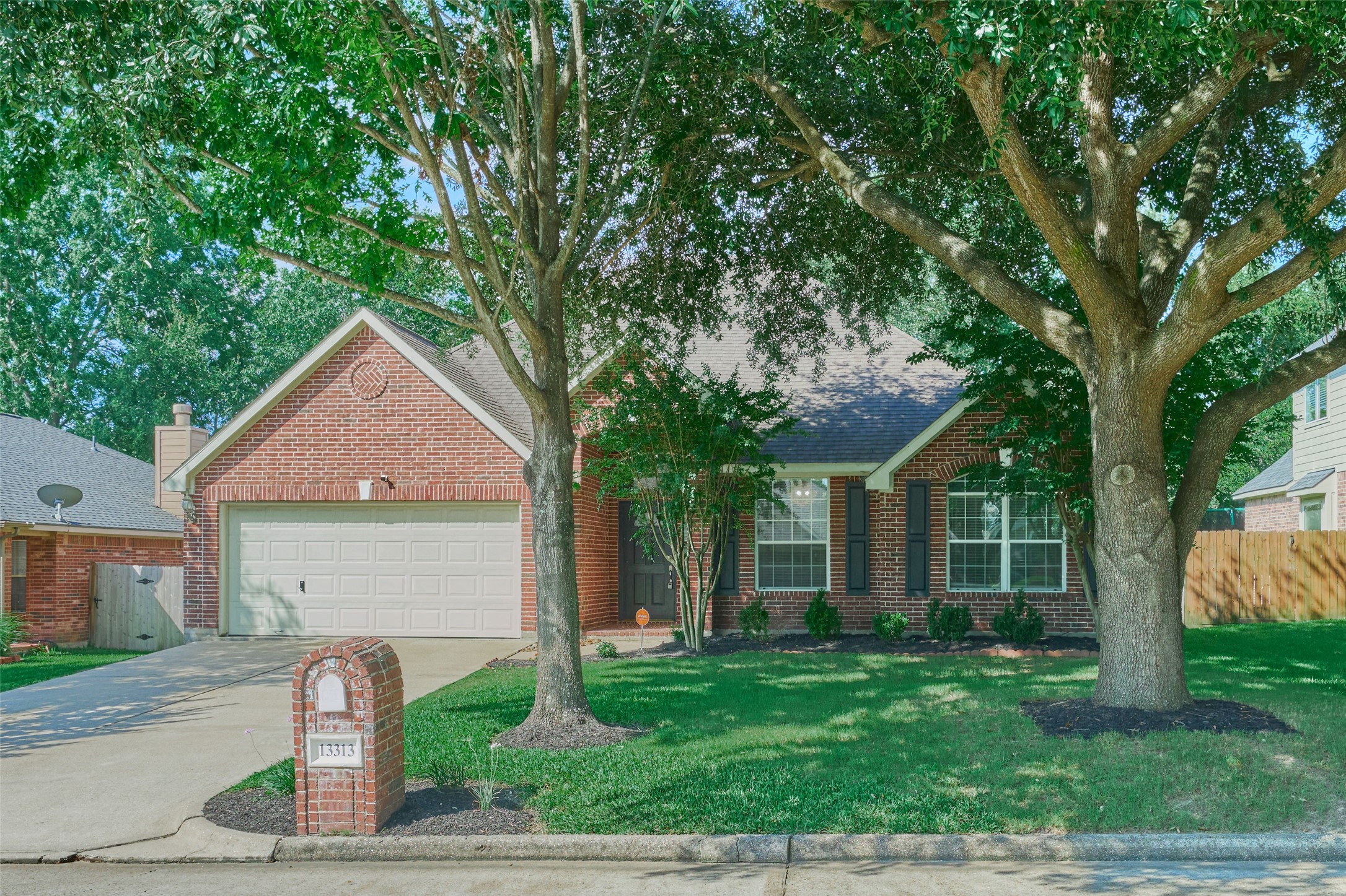 13313 Enchanted Way Montgomery, TX 77356 - Photo 35 of 36 a front view of a house with a yard and tree s