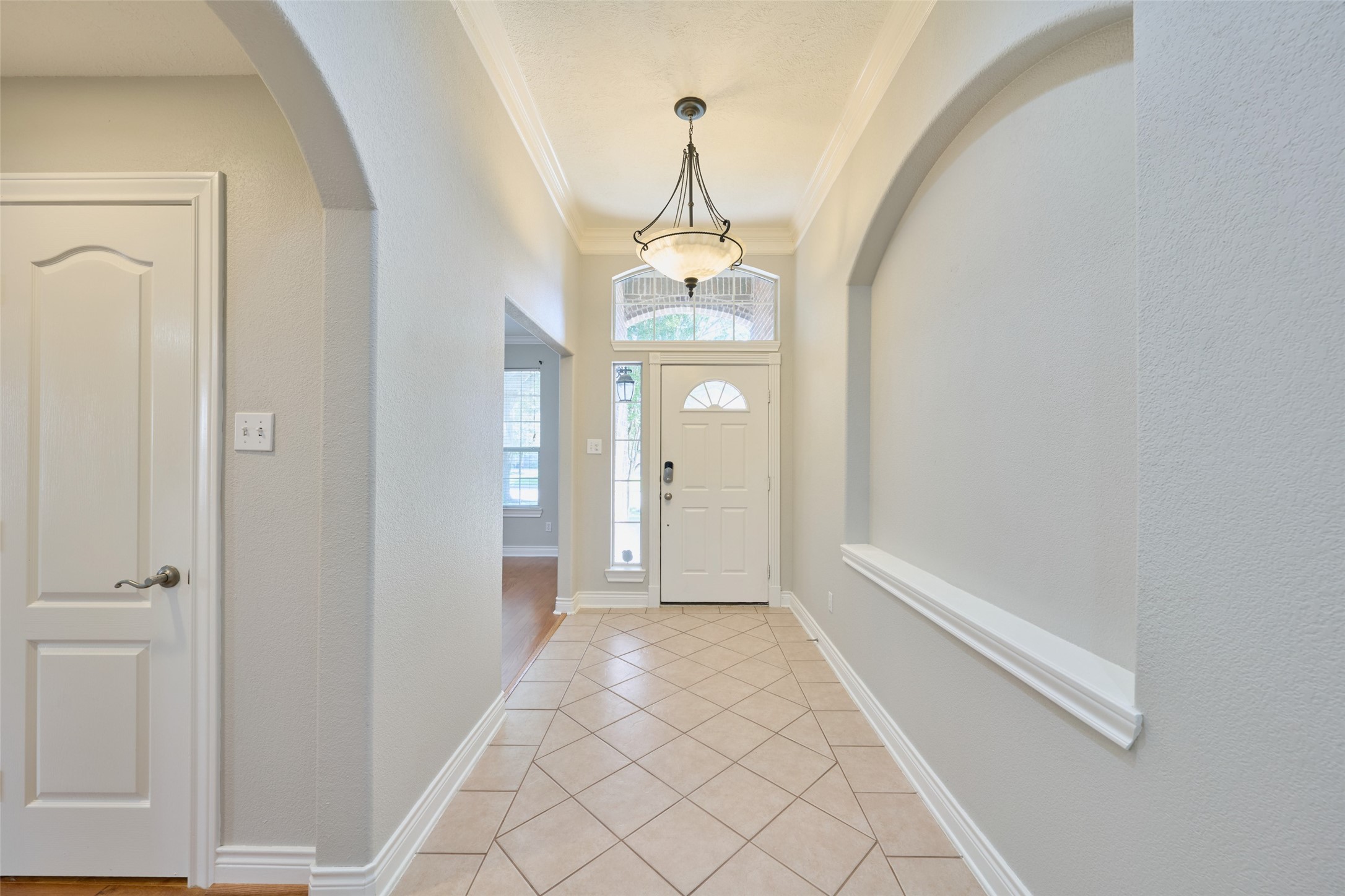 13313 Enchanted Way Montgomery, TX 77356 - Photo 3 of 36 a view of a hallway with wooden floor and a window