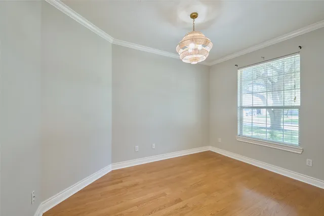 a view of a livingroom with a ceiling fan and window