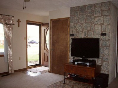 706 Fremont Road Valparaiso, IN 46385 - Photo 4 of 10 a living room with furniture and a flat screen tv