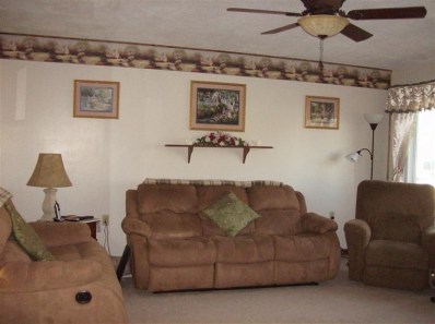 706 Fremont Road Valparaiso, IN 46385 - Photo 7 of 10 a living room with furniture and a lamp