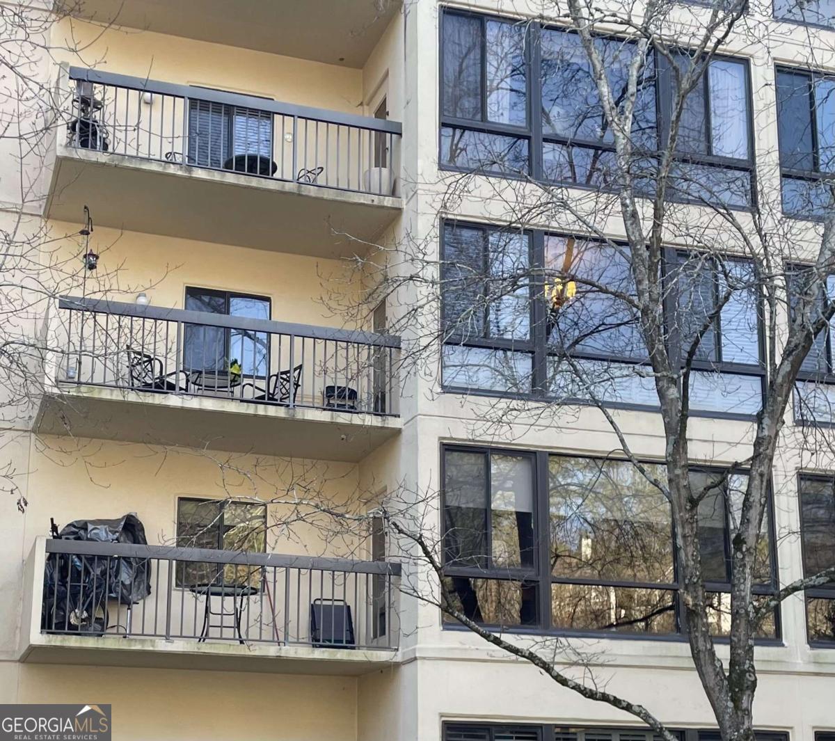 a balcony with furniture and a table