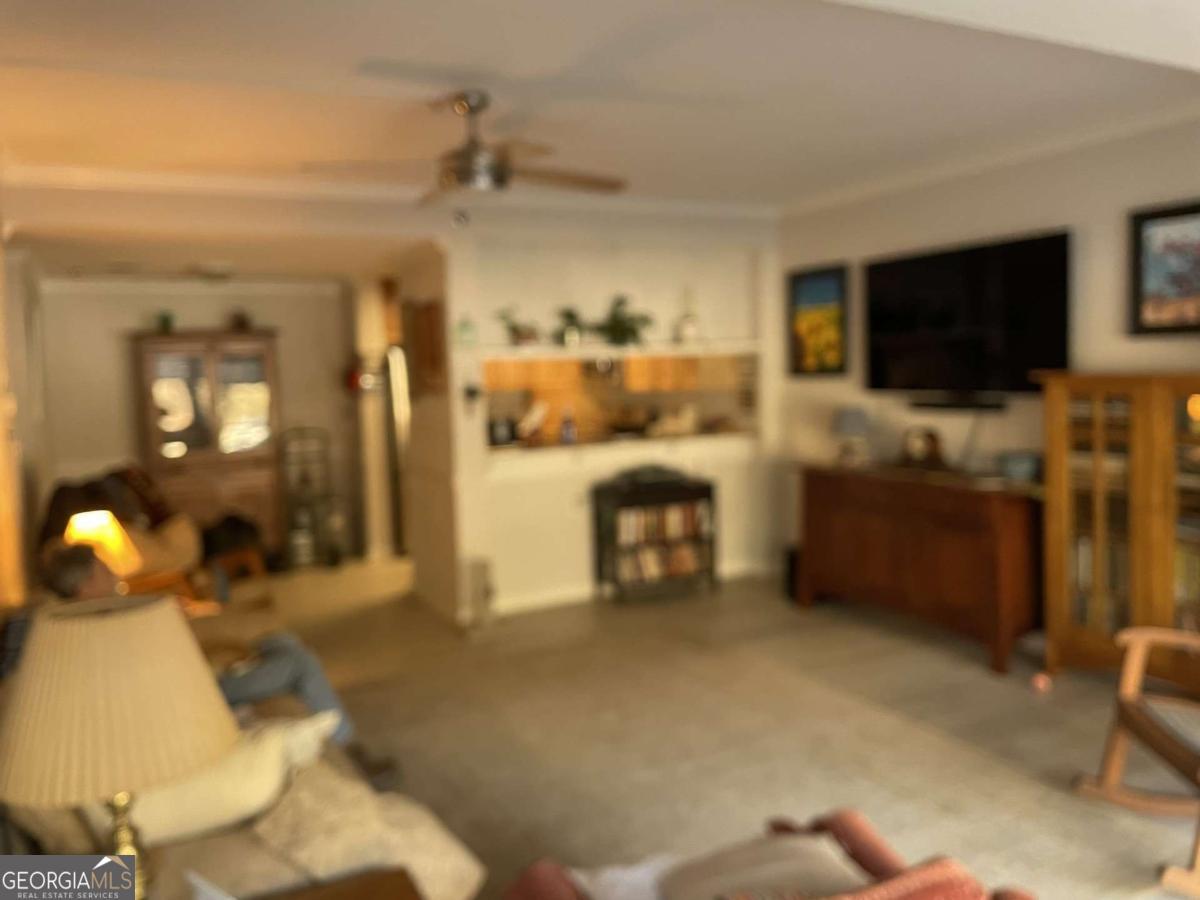 1800 Clairmont Road, Unit 223 Decatur, GA 30030 - Photo 2 of 7 a living room with furniture and a flat screen tv