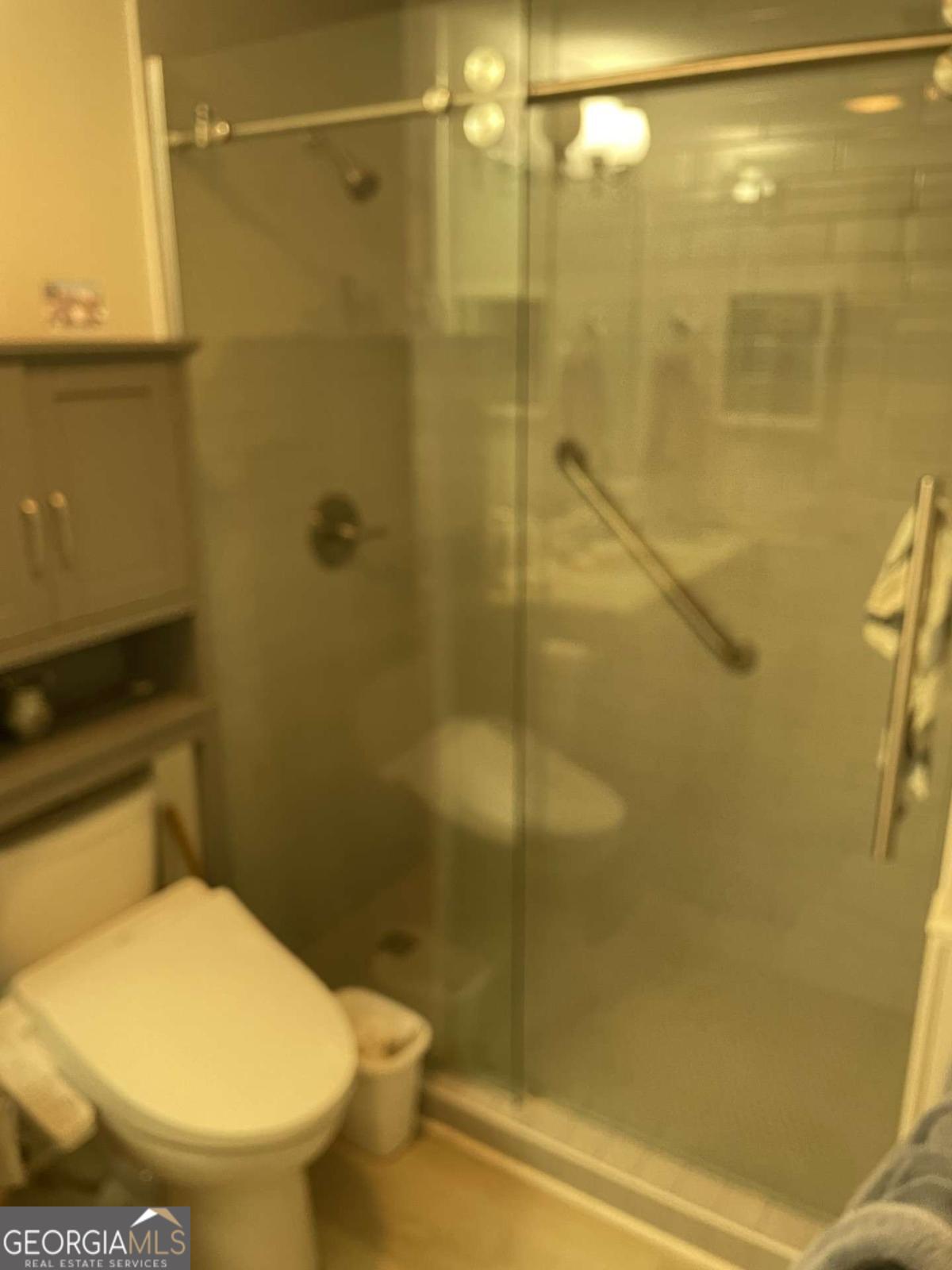 1800 Clairmont Road, Unit 223 Decatur, GA 30030 - Photo 6 of 7 a bathroom with a toilet and a shower