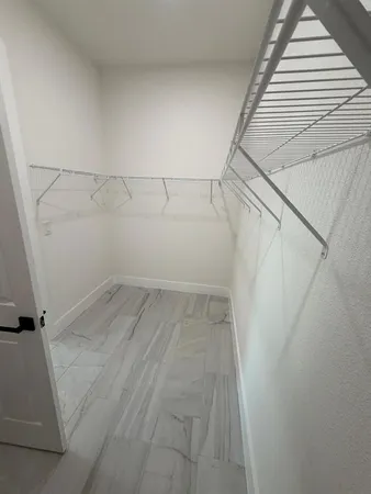 a view of a room with racks on the wall