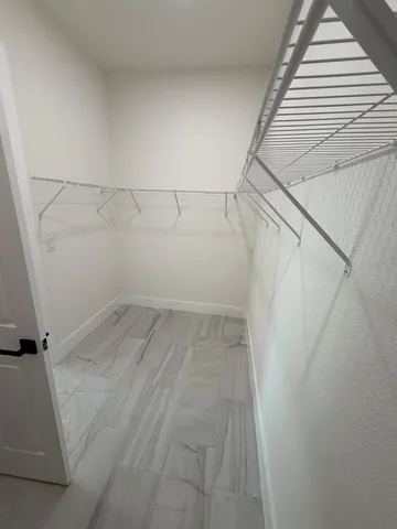 a view of a room with racks on the wall