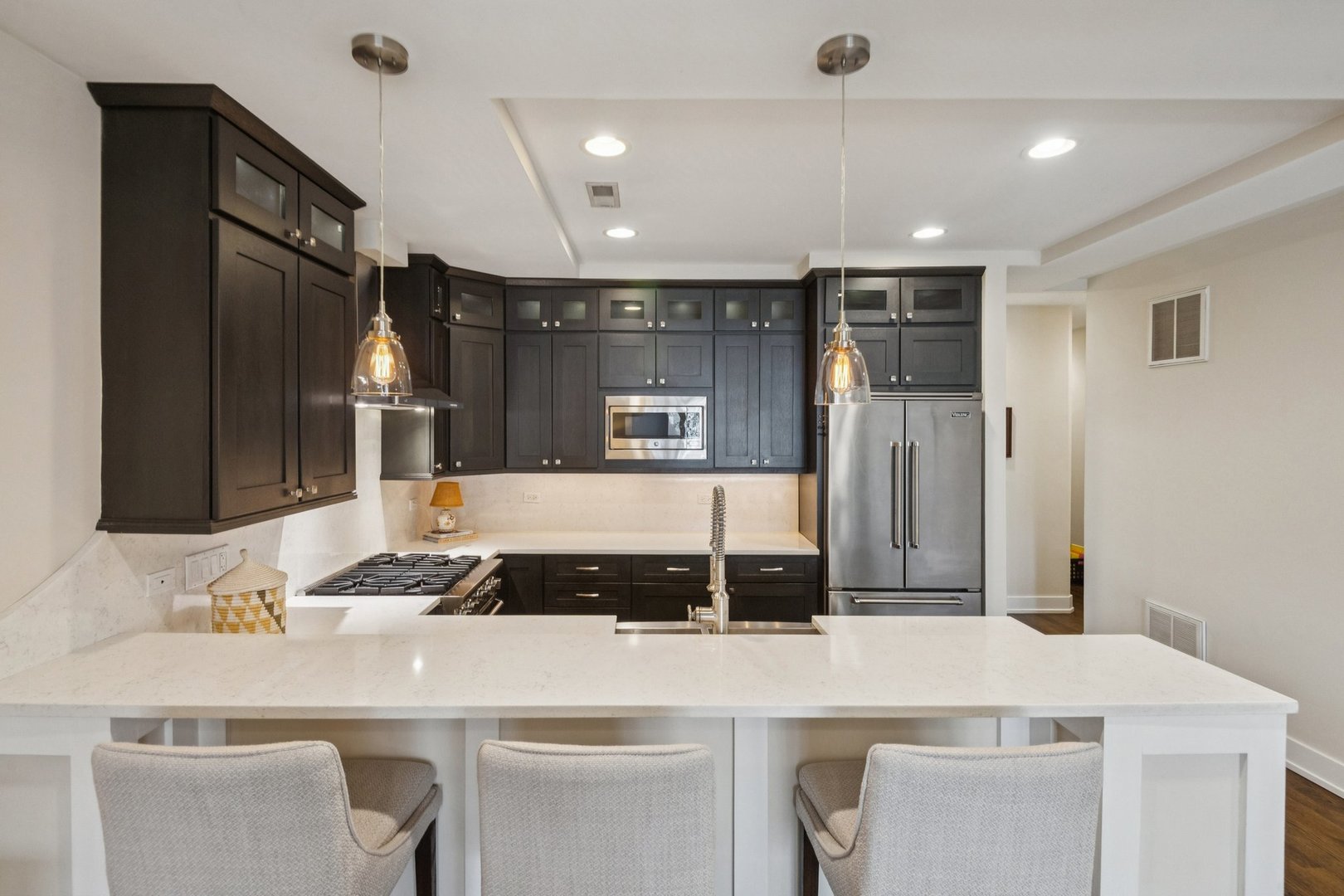 1011 North Wolcott Avenue, Unit 2N Chicago, IL 60622 - Photo 10 of 23 a kitchen with a table and chairs